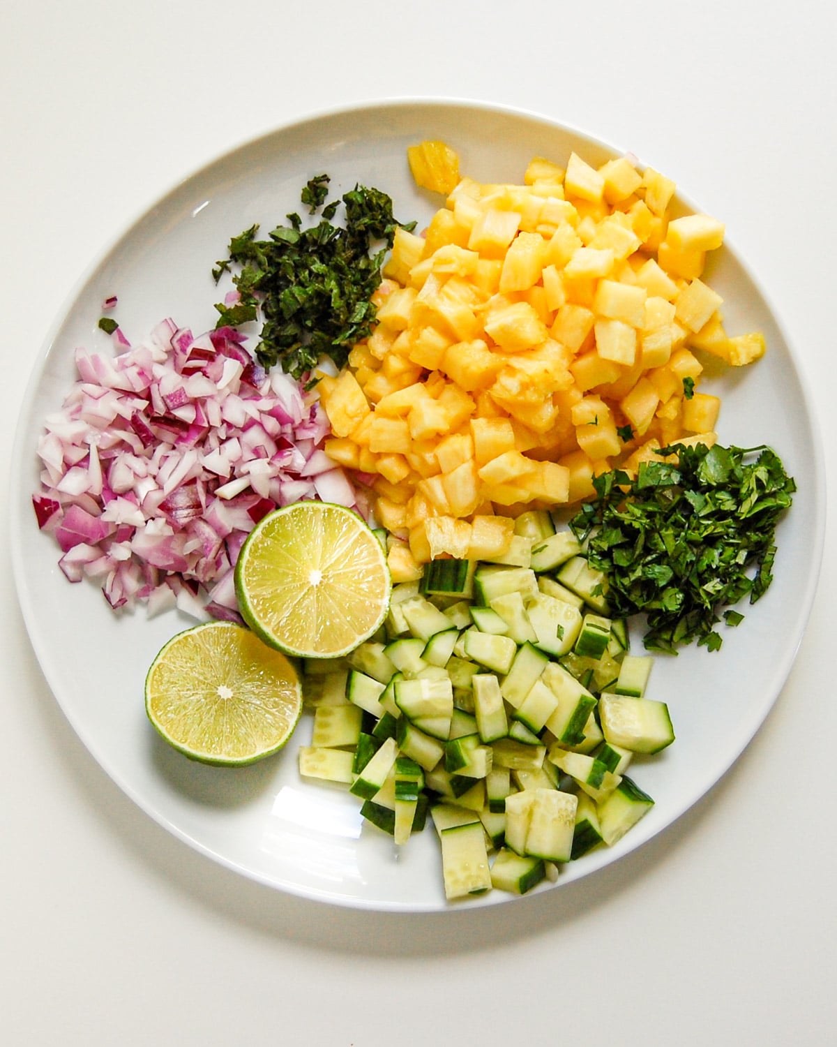 pineapple salsa ingredients on a plate