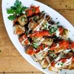 A low carb patatas bravas uses jicama instead of potatoes with smoky romesco and roasted garlic aioli. Easy Spanish tapas style appetizer perfect for your next party. Paleo and Whole30! #spanish #recipe #glutenfree #dairyfree #tapas #jicama #appetizer #peelwithzeal #romesco #aioli