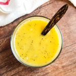 healthy poppy seed dressing in bowl with wooden spoon