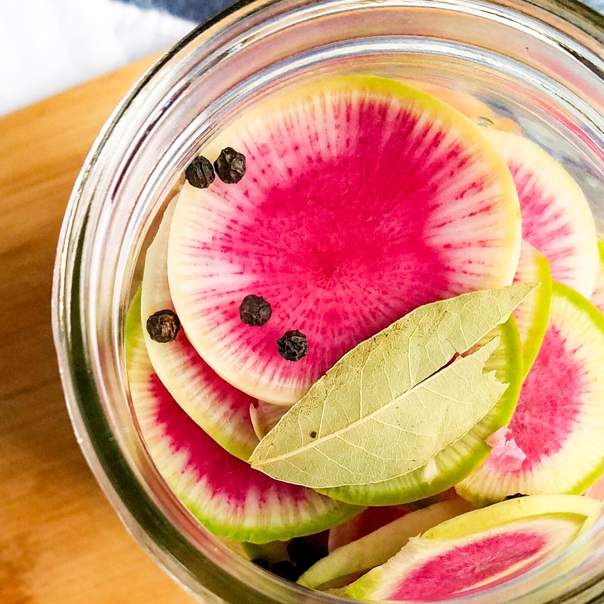 Watermelon radishes in a jar.