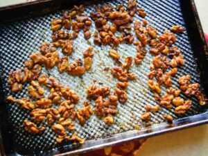 spiced walnuts on baking sheet