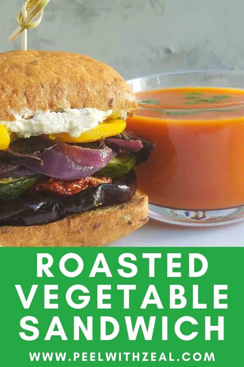 roasted vegetable sandwich next to a cup of soup.