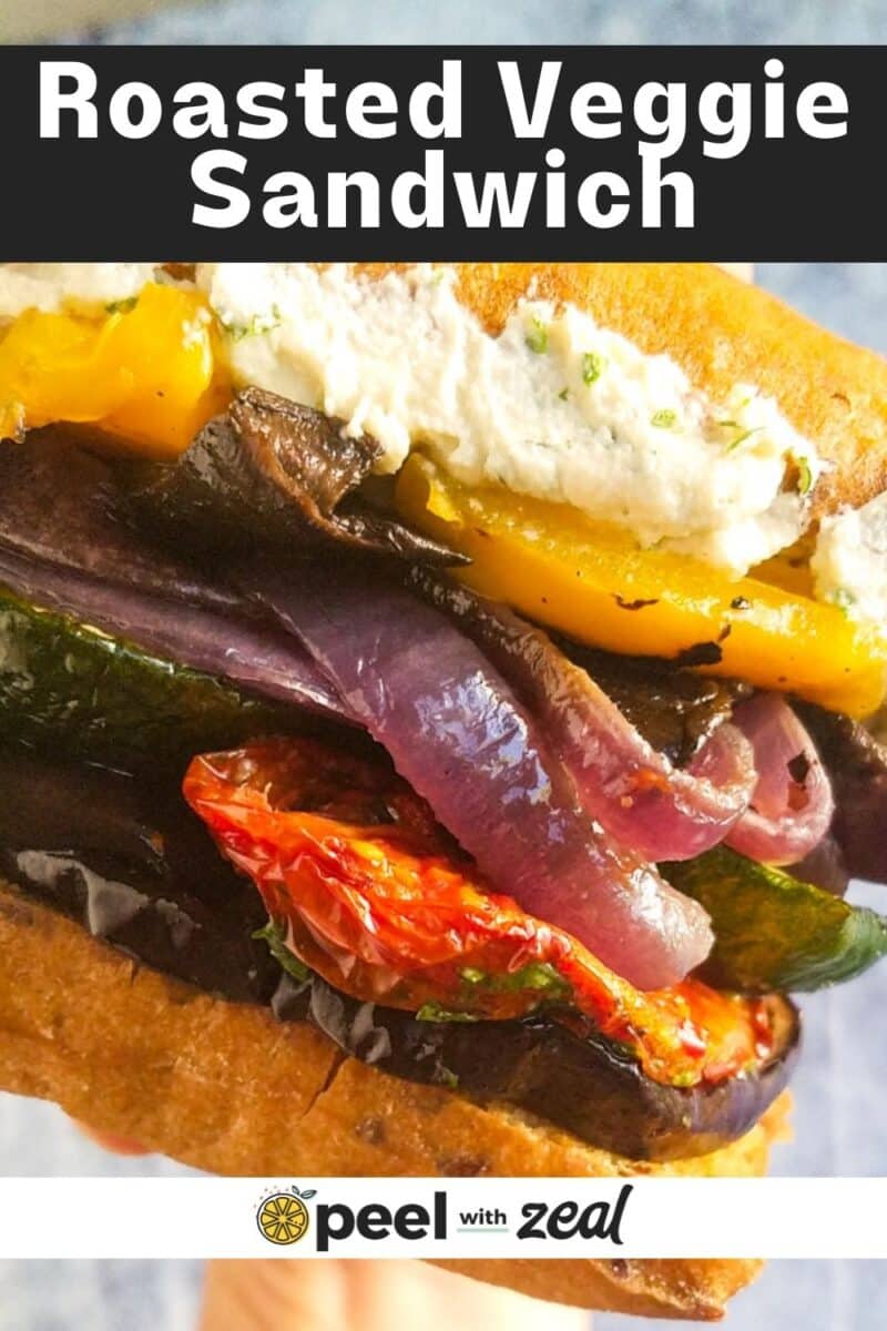 a person holding a vegetable sandwich.