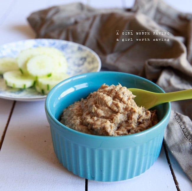 sardine pate in blue ramekin on white wooden table