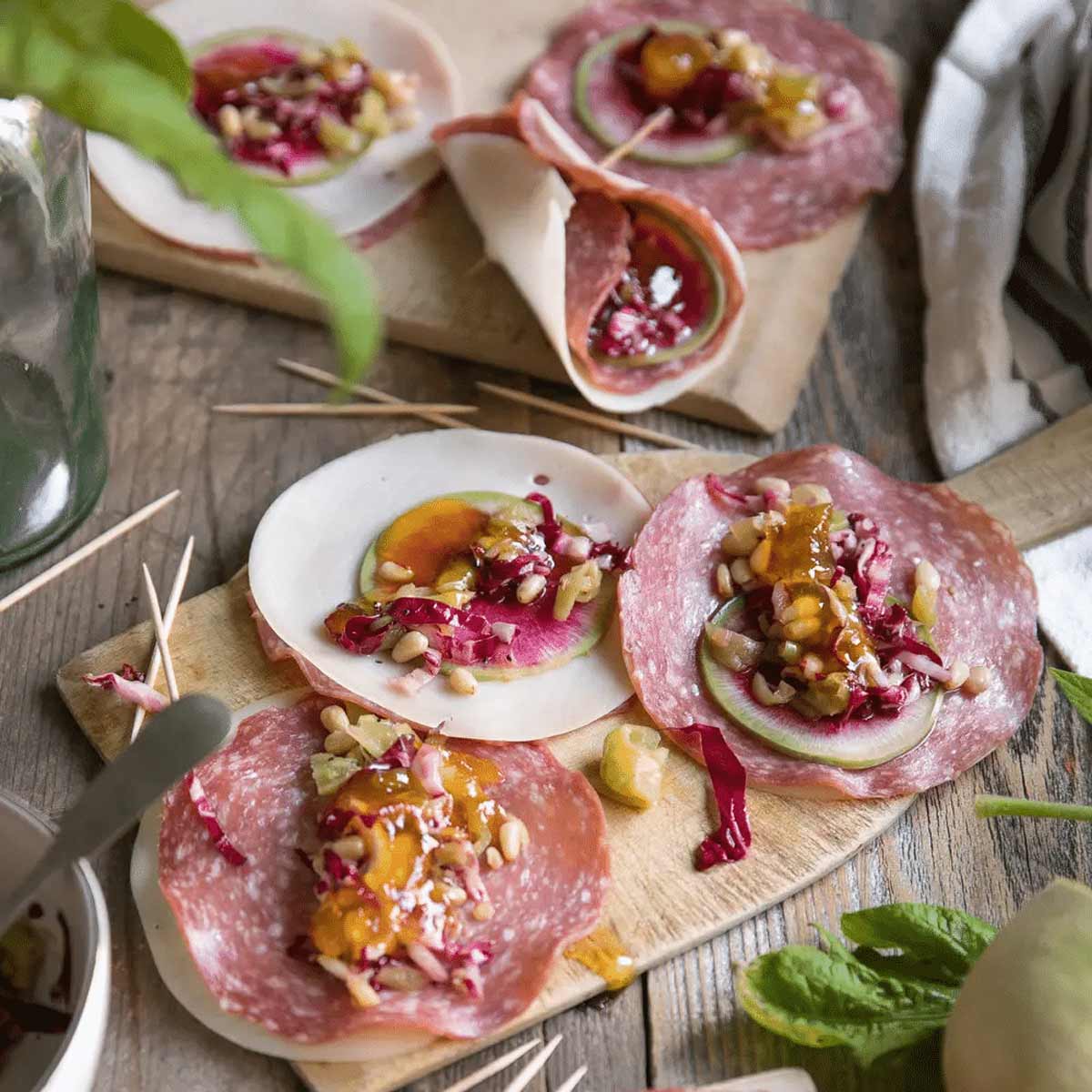 Watermelon radish in a ham place on a wooden countertop.
