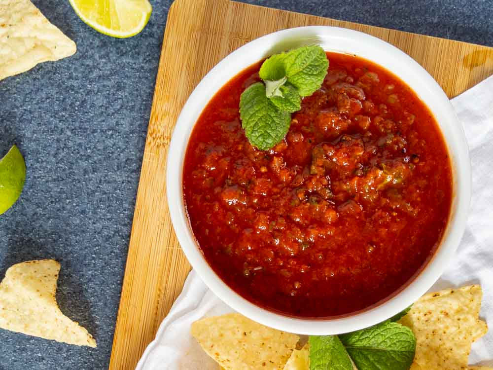 salsa made in blender in bowl with chips