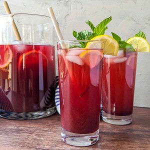 blueberry iced tea in glasses with pitcher