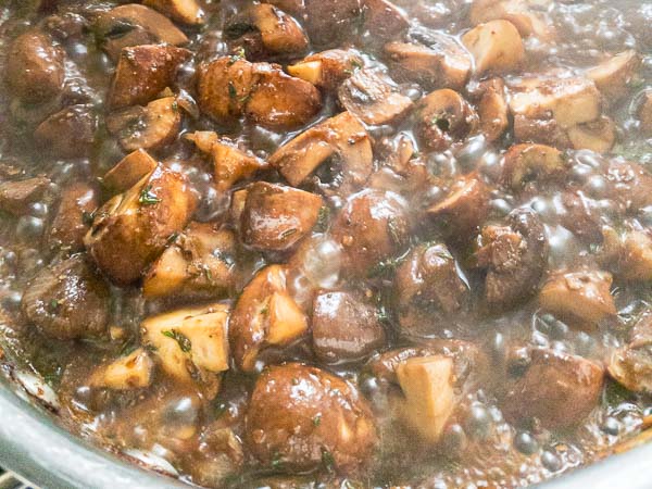 chestnut mushrooms cooking in madeira wine.