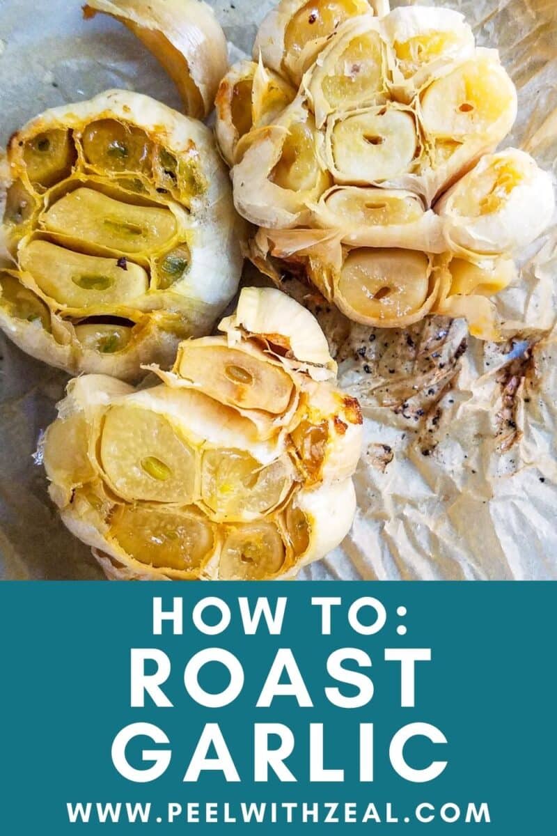 Halved roasted garlic bulbs on parchment paper perfectly capture the essence of this culinary staple. Learn "How To: Roast Garlic" flawlessly by visiting our website.