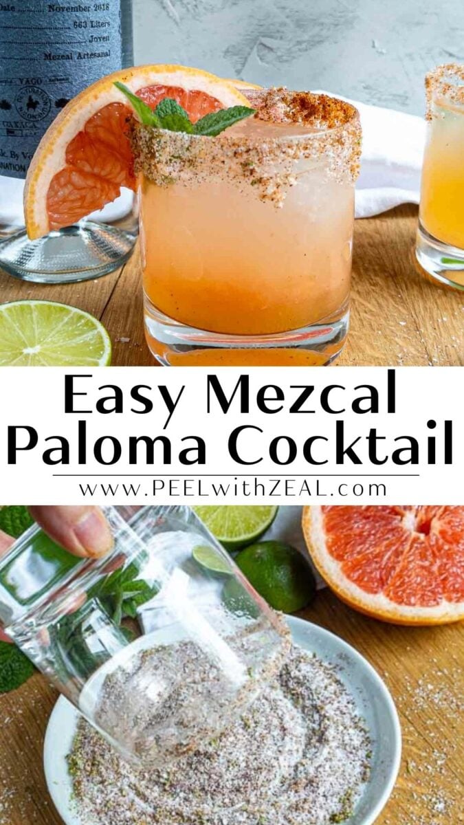 A mezcal paloma cocktail garnished with grapefruit and fresh mint sits on a wooden surface. The rim is coated with seasoning, while a hand rolls another glass for a mezcal paloma in salt. Sliced citrus fruits are scattered nearby.