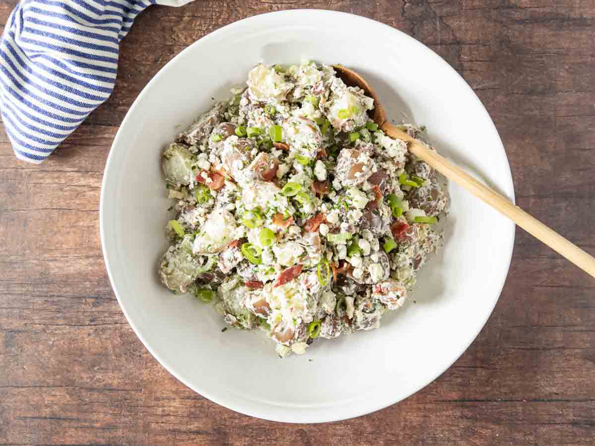 bacon and blue cheese potato salad in a serving bowl