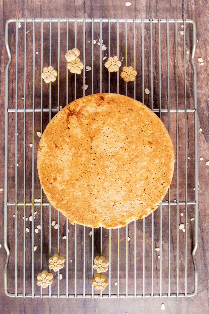 cooling dog cake on a wire baking rack.