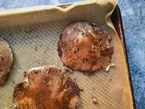 portabella mushroom caps on roasting pan