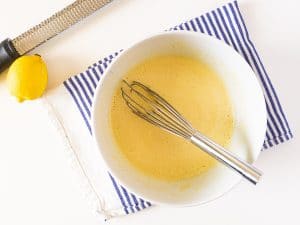 lemon custard being whisked in a bowl
