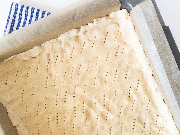 dough being docked with fork