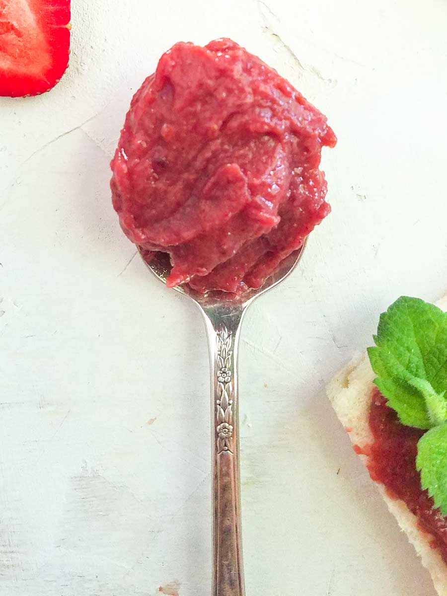 strawberry fruit spread recipe on a spoon