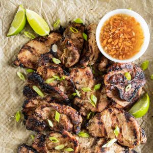 lemongrass grilled pork on a tray with dipping sauce
