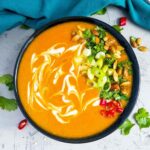 thai pumpkin soup in a black bowl