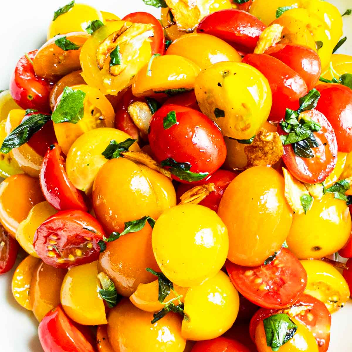 cherry tomato salad on a white surface