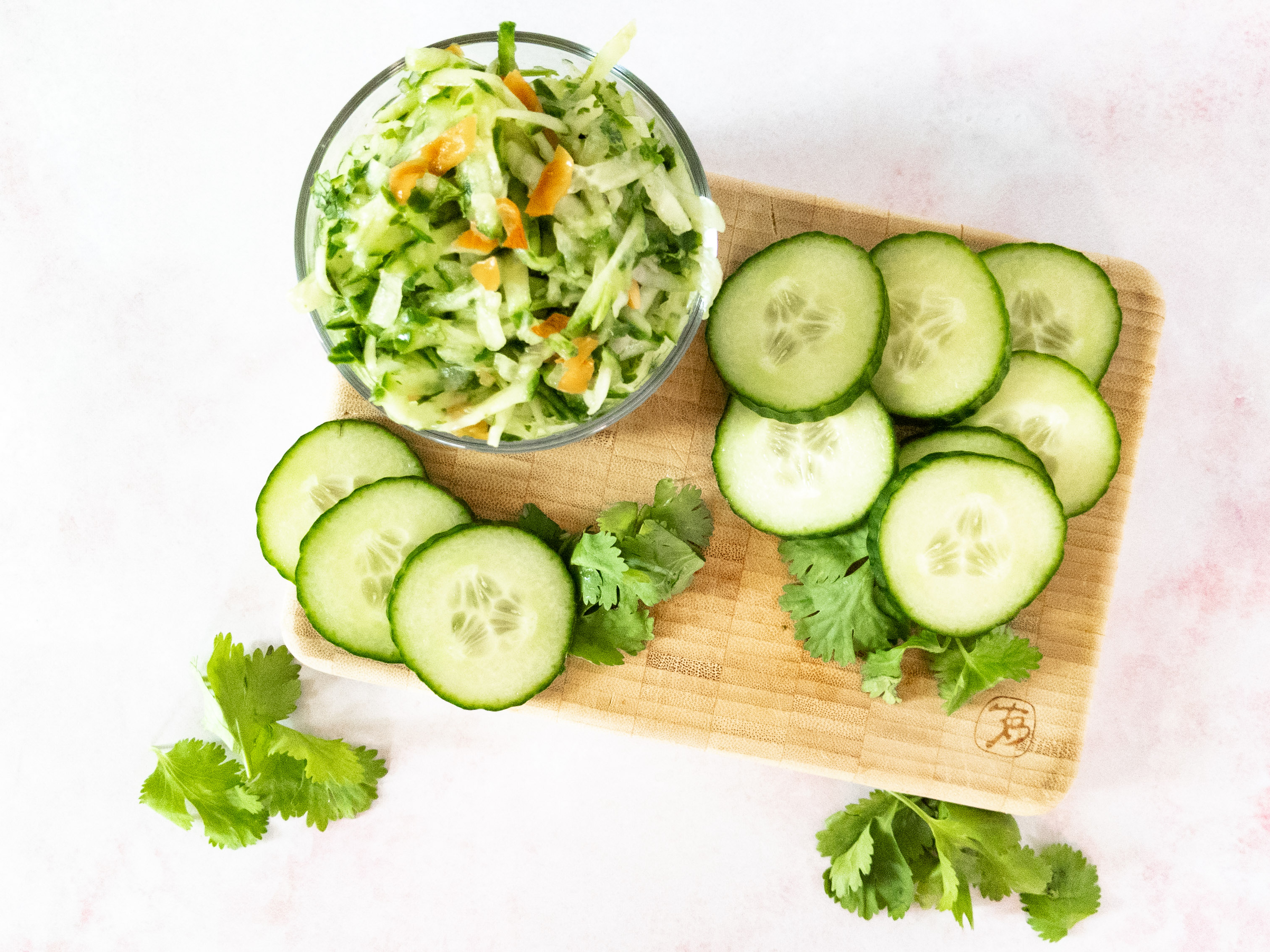 chutney in bowl on cutting board with cucumbers