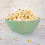 duck fat popcorn in a green bowl