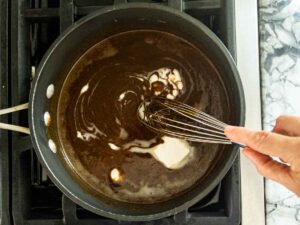 whisking butter into warm molasses mixture