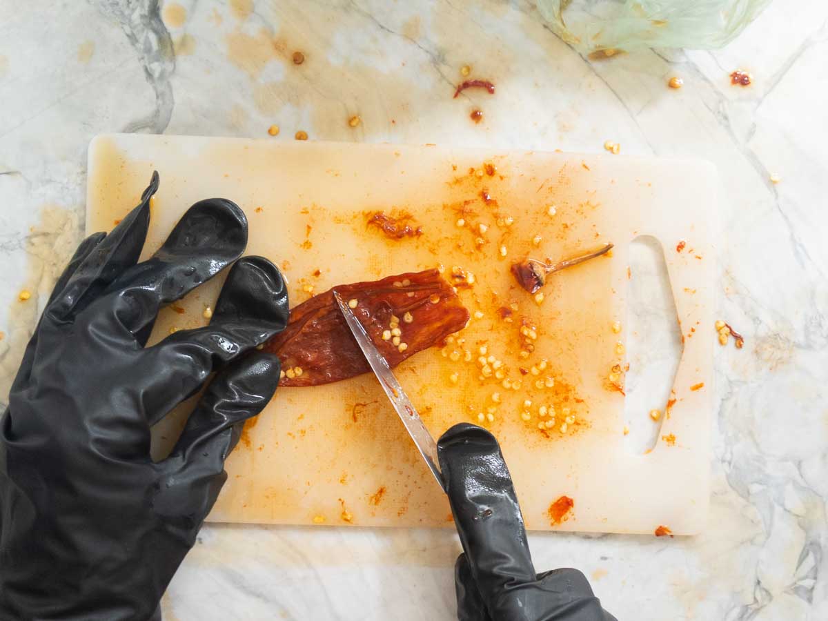 destemming softened chile peppers
