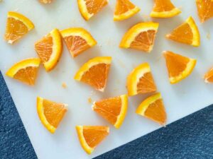orange slices on a cutting board