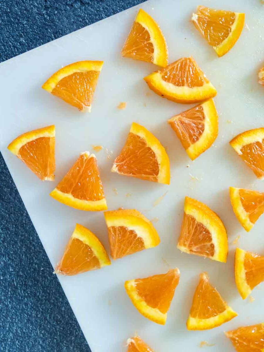 orange slices on a cutting board