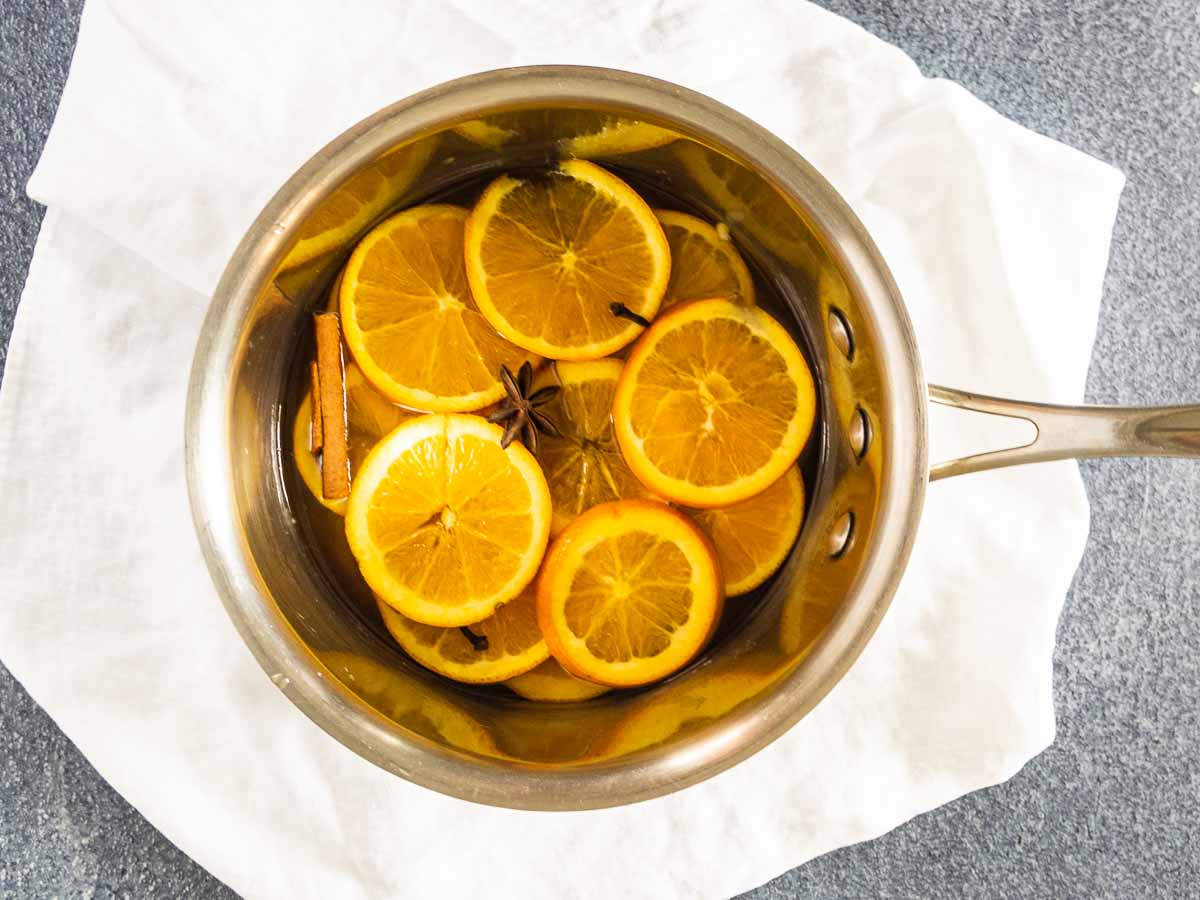 oranges in sugar water with spices