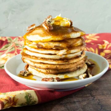 stack of pancakes with pumpkin syrup