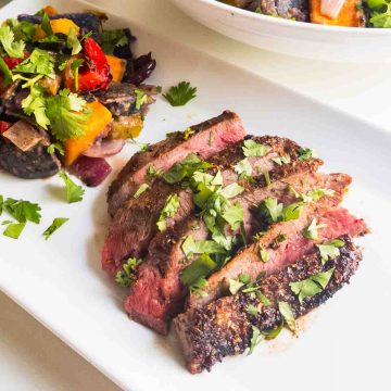 seasoned grilled flank steak on plate