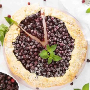 serviceberry galette with a grain free crust with slice being removed