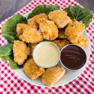 gluten free chicken nuggets on a plate with dipping sauces