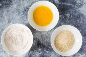 bowls with rice flour, egg wash and panko
