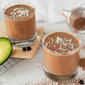 two glasses of chocolate avocado smoothies