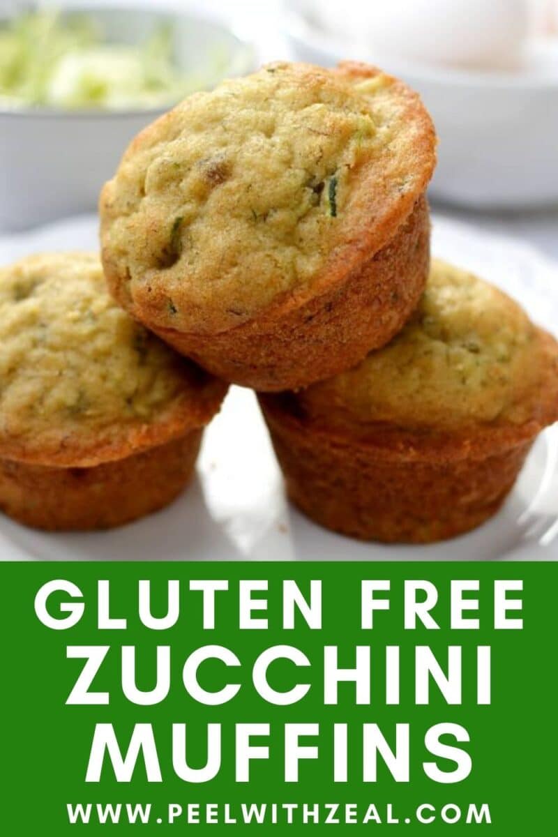 Three delicious gluten-free zucchini muffins stacked on a plate with a vibrant green text overlay. Discover more at the website URL below.