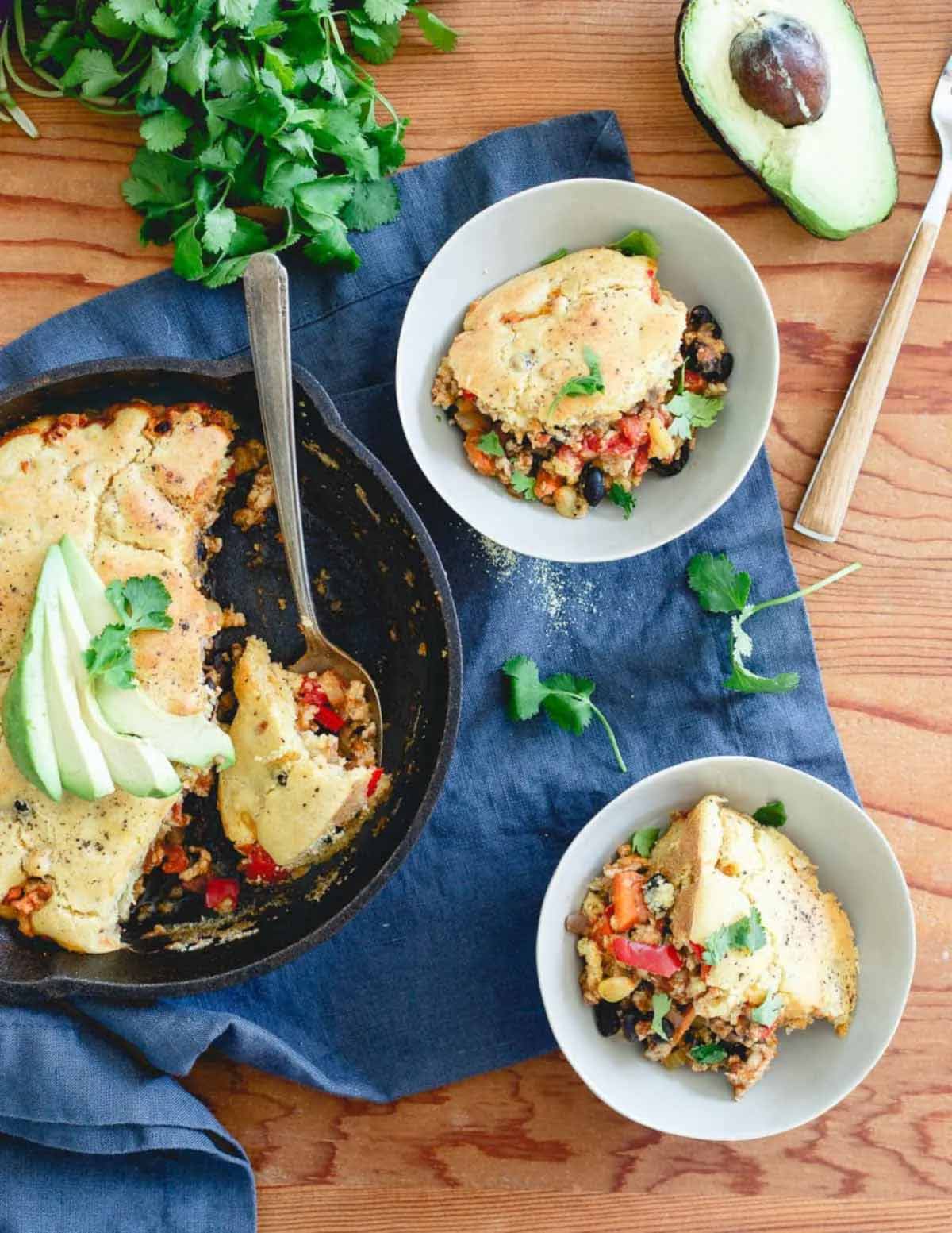 turkey cornbread pie in skillet being served