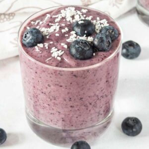blueberry avocado smoothie topped with coconut