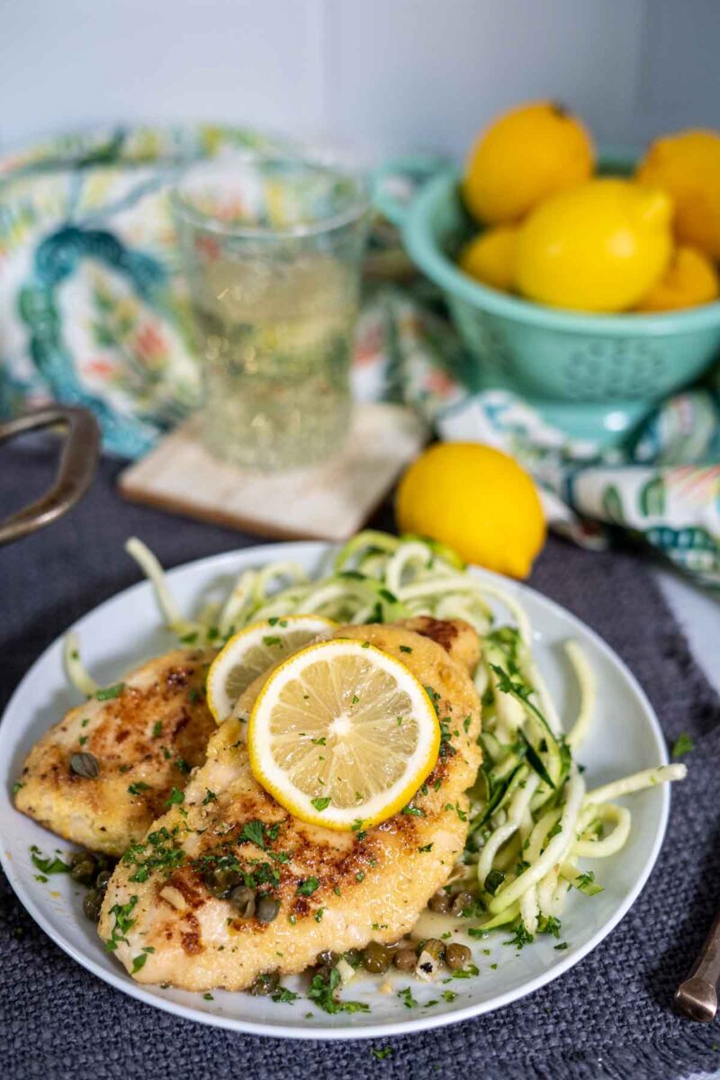 low carb chicken piccata serving over zucchini noodles