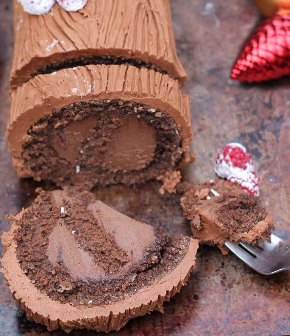 chocolate yule log sliced with berries