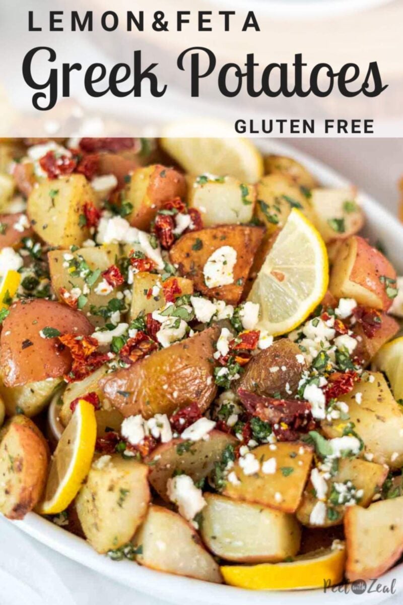roasted potatoes in serving dish topped with feta
