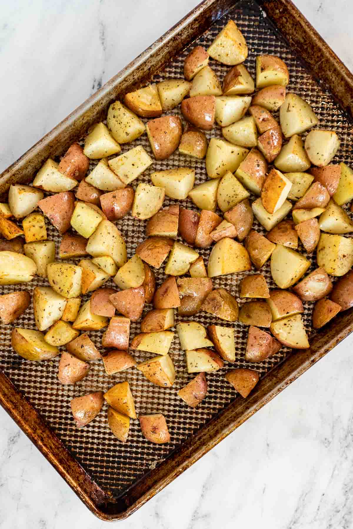 Roasted potatoes on a sheet pan.