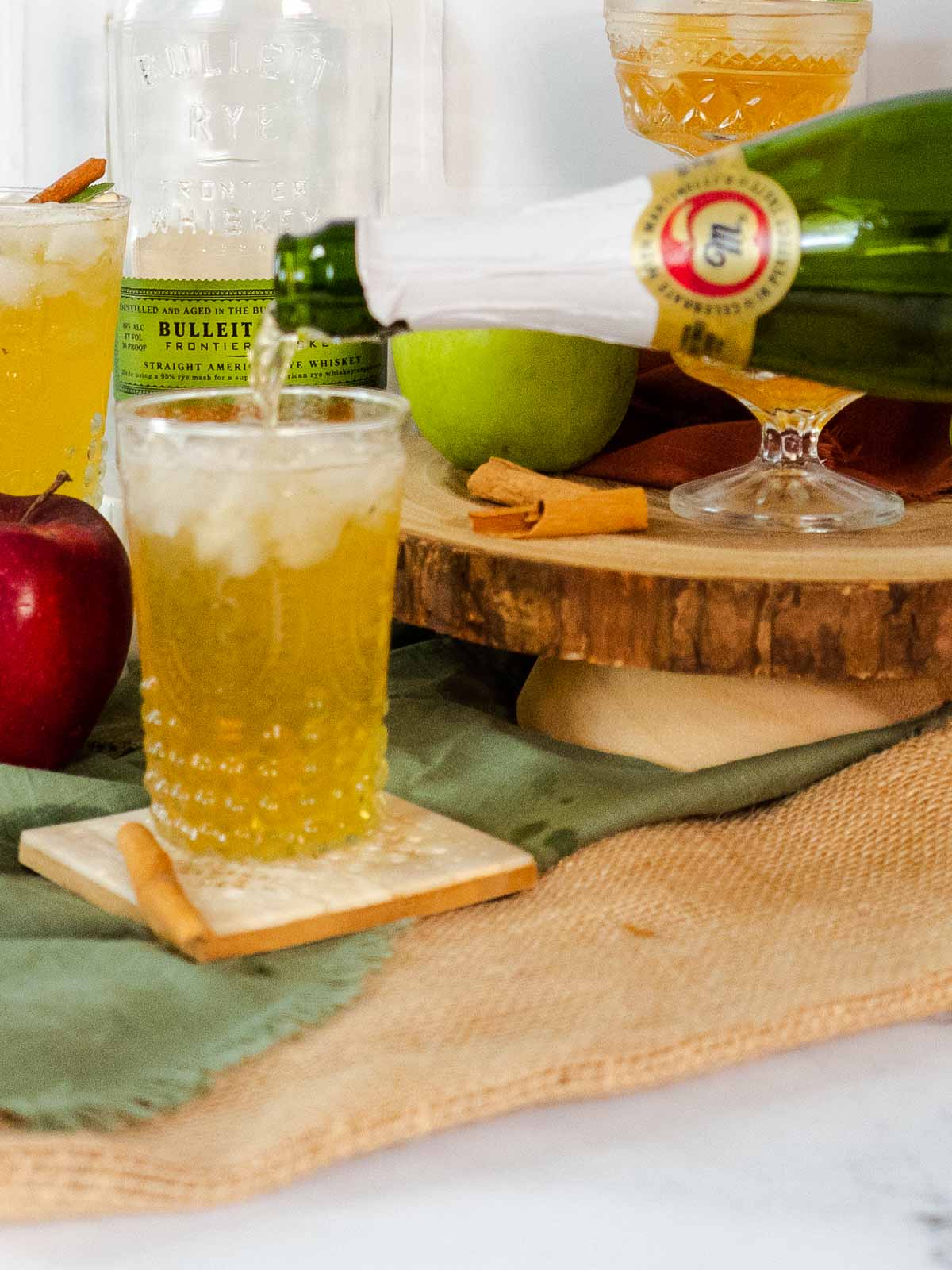 topping whiskey smash with sparkling apple cider