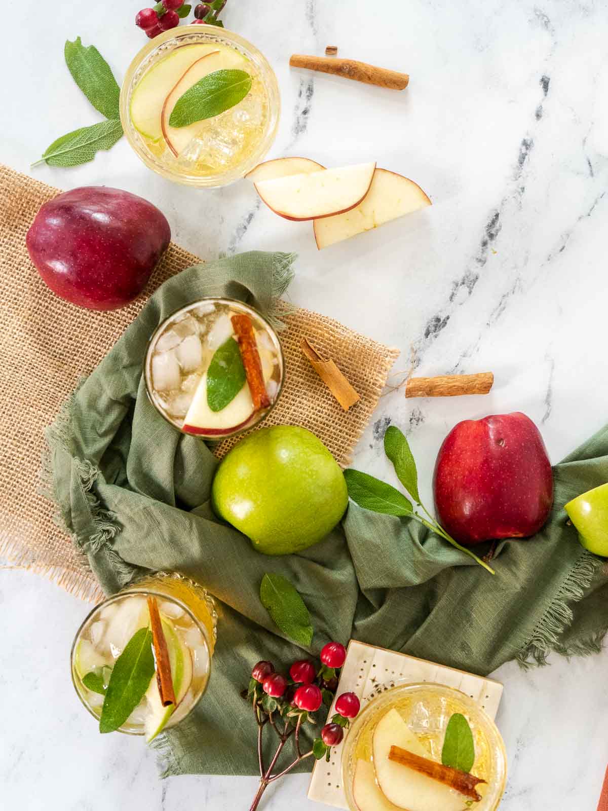 apple cider whiskey smash cocktail on marble counter