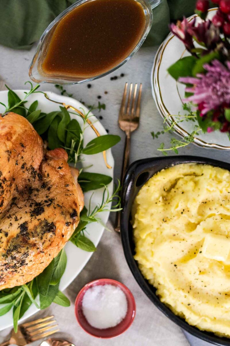 thanksgiving table with small turkey and small mashed potatoes