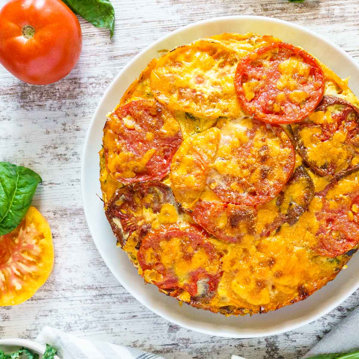 crustless tomato pie on a white plate
