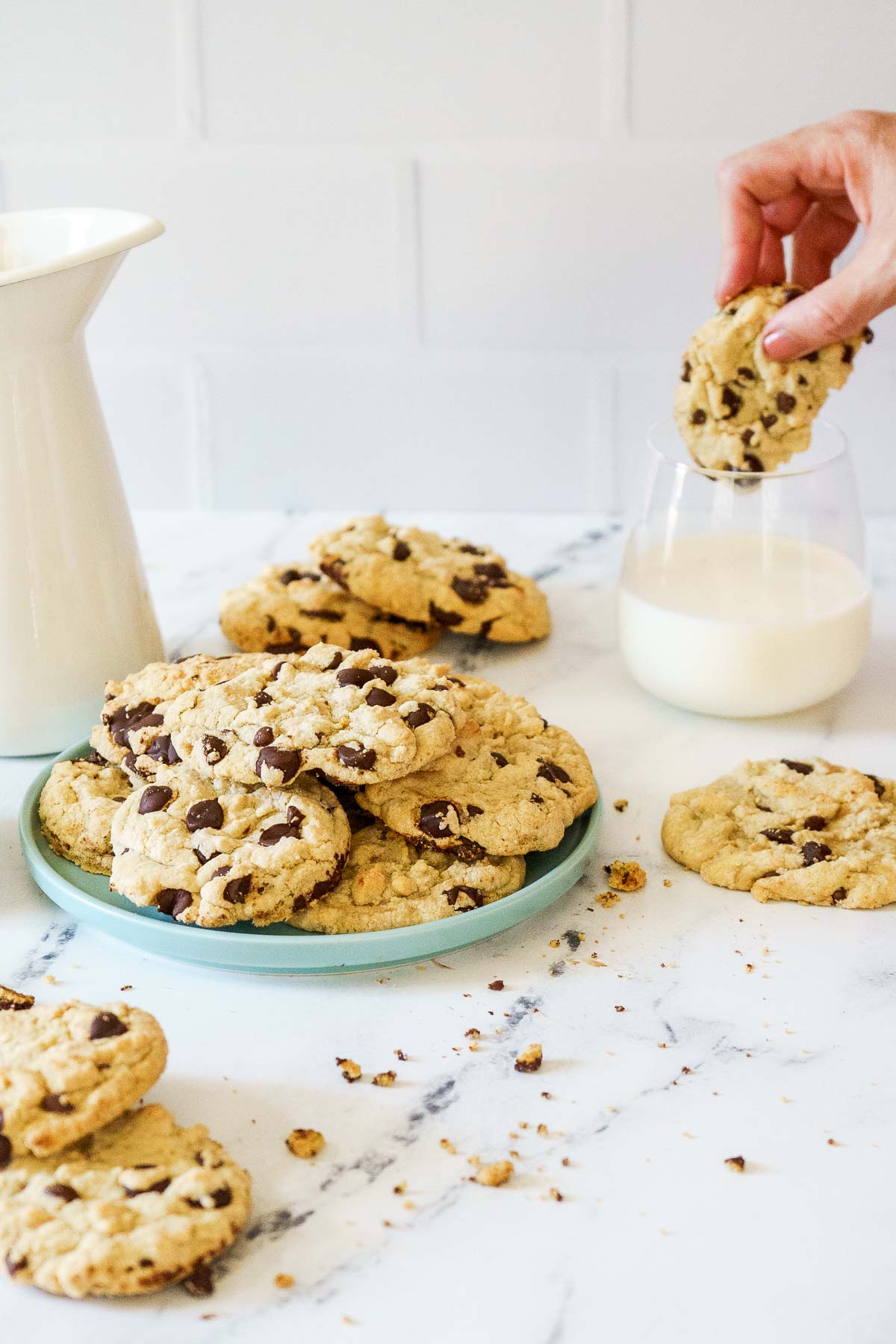dipping gluten free cookie into dairy free milk