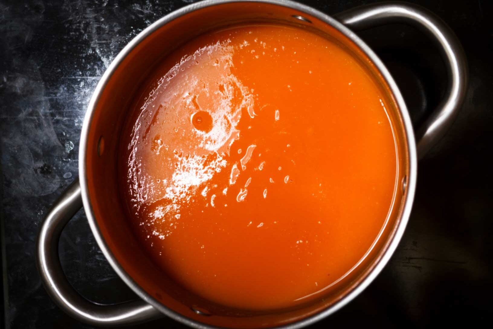 Pumpkin soup in a stock pot.
