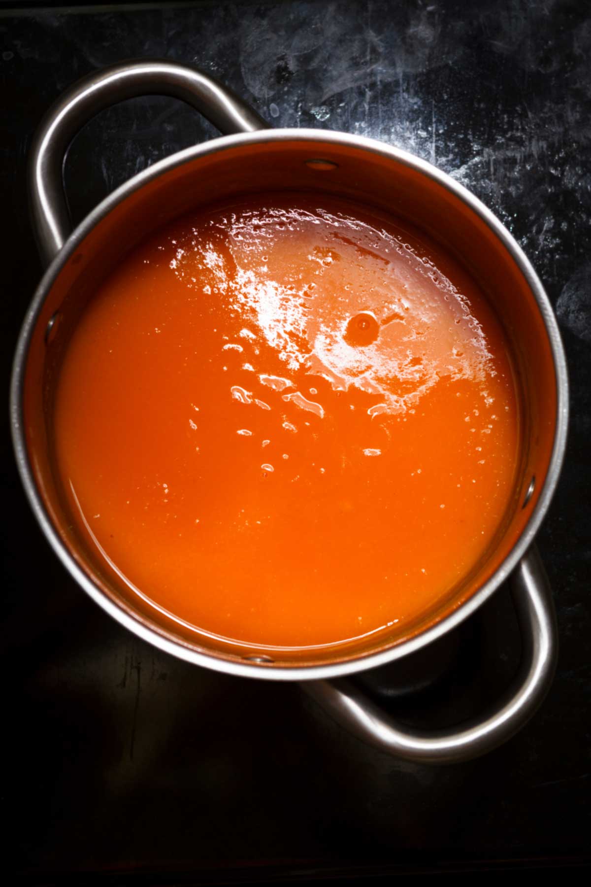 Pumpkin soup in a stock pot.